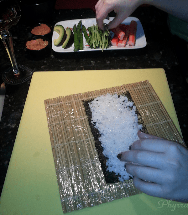 Spreading rice on seaweed