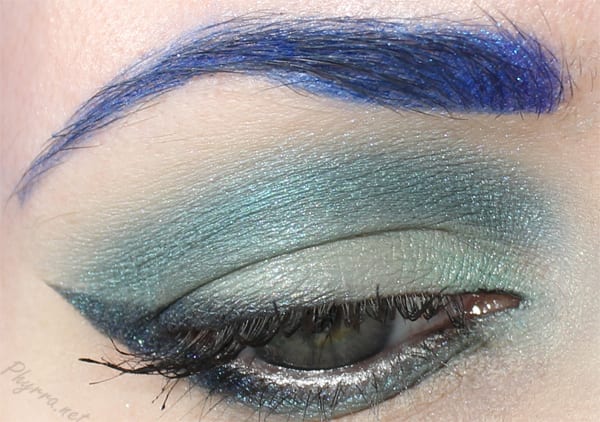 Wearing Buyer's Remorse on the lid and lower lash line, Mermaid's Plumage in the crease, Celestial Crow as liner and outer lower lash line, Grandiloquent at the inner corner.