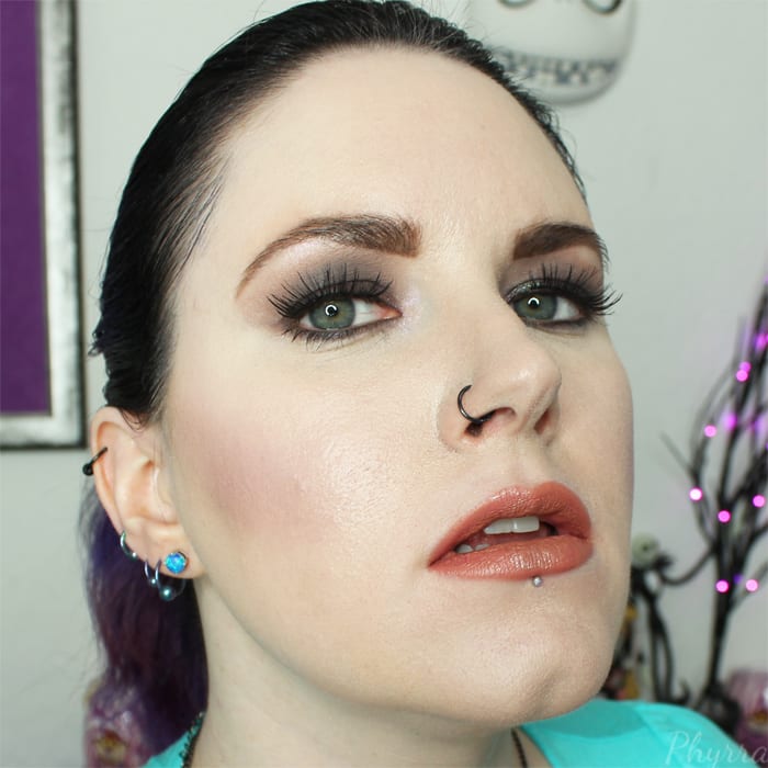 Wearing Urban Decay eyeshadow, blush and lipstick