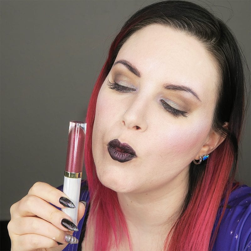 Urban Decay Vice Special Effects Lipstick Topcoat in Bruja on top of black lipstick