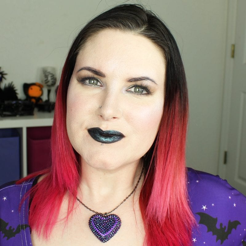 Urban Decay Vice Special Effects Lipstick Topcoat in Ritual swatched on pale skin on top of black lipstick