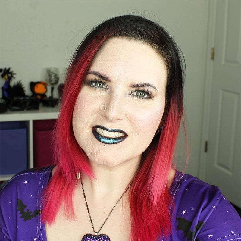 Urban Decay Vice Special Effects Lipstick Topcoat in Ritual and White Lie swatched on pale skin on top of black lipstick