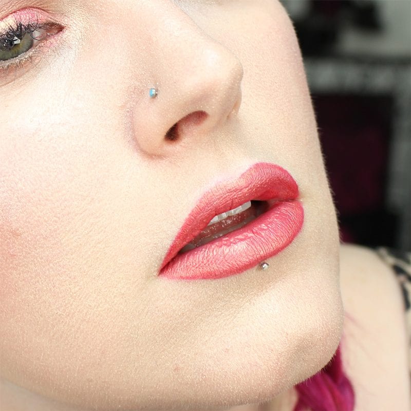 Wearing Kat Von D Beauty X with Saucebox Festival Love Skin Veil on the lips