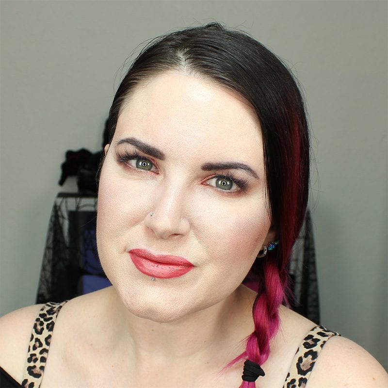 Wearing Kat Von D Beauty X with Saucebox Festival Love Skin Veil on the lips