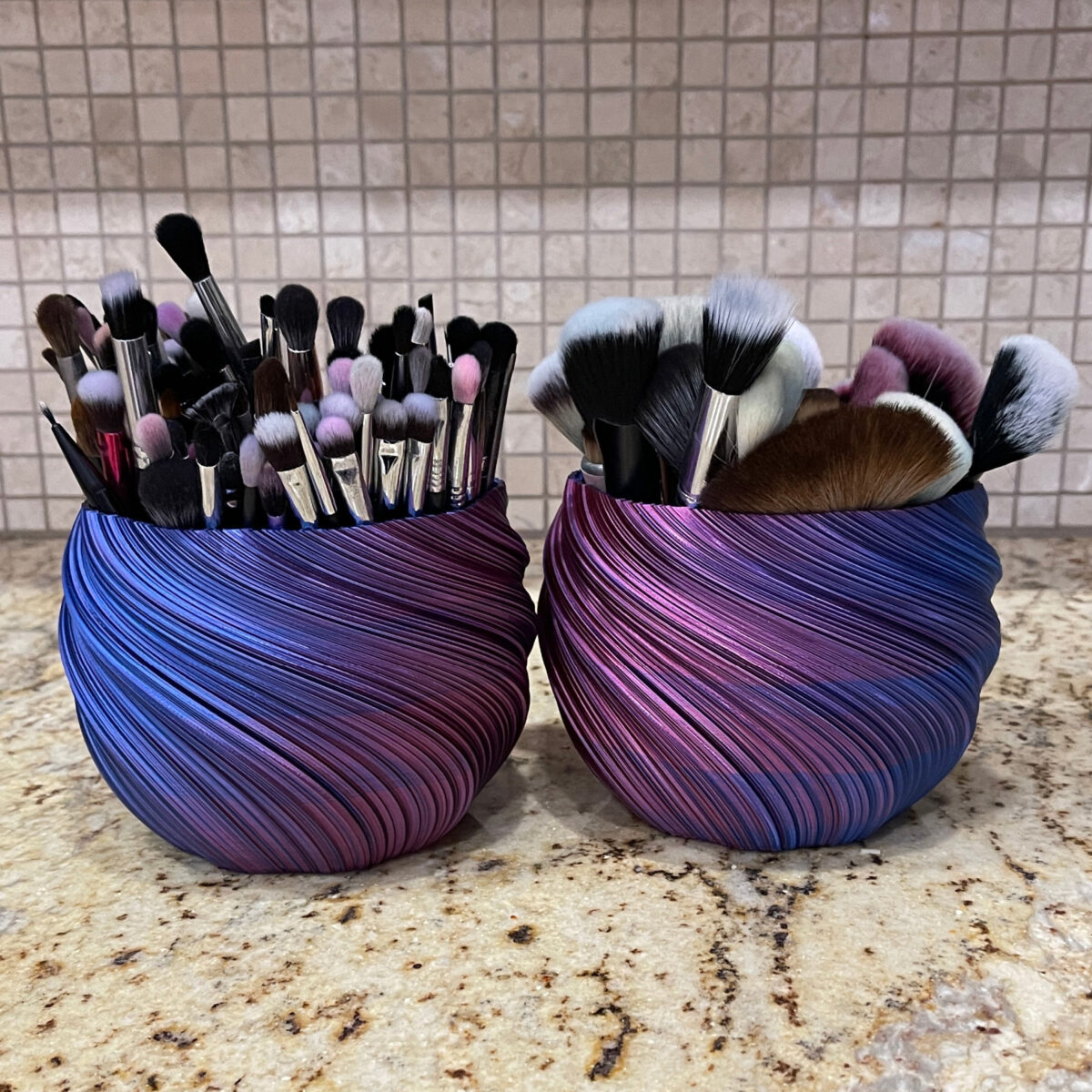 Cordelia's blue and purple swirled makeup brush holders