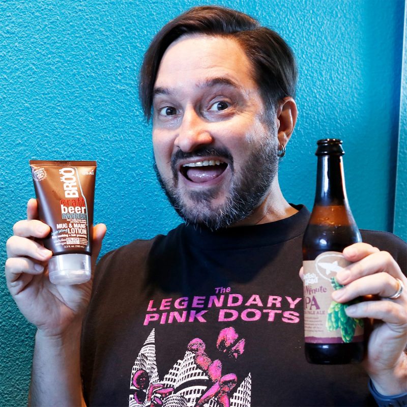 Ray holding the BRÖÖ Multi-Tasking Mug and Mane Lotion