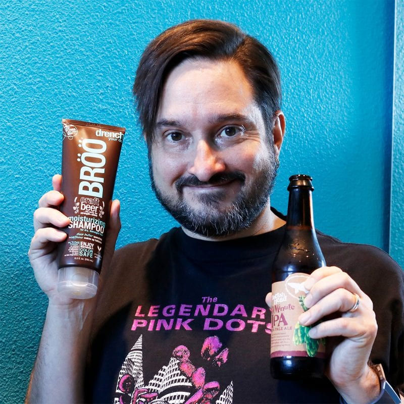 Ray holding the BRÖÖ Moisturizing Craft Beer Shampoo 