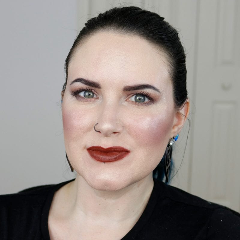 Urban Decay Naked Heat Vice Lipstick in En Fuego swatched on pale skin