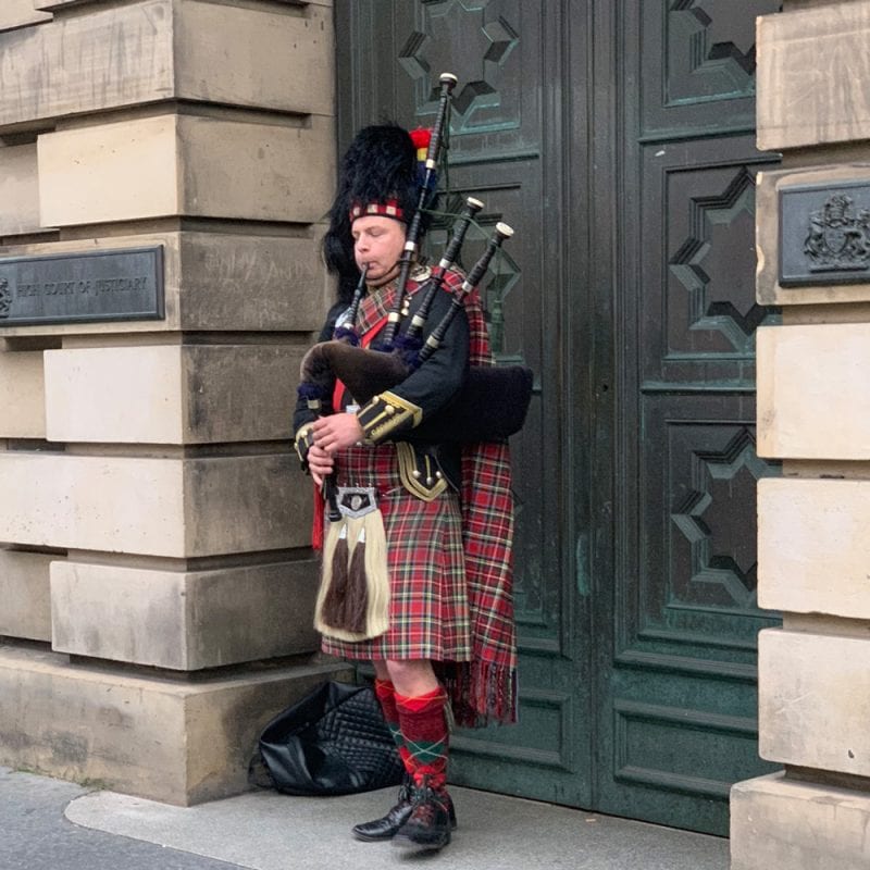 Man in Kilt Playing Bagpipes