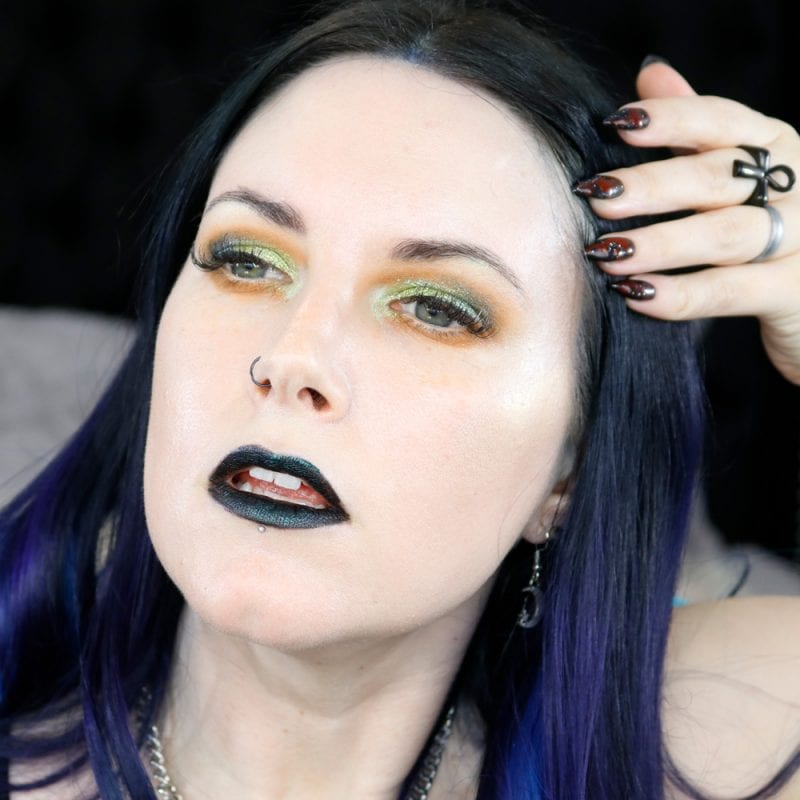 Courtney is wearing Black Moon Orb of Light Palette plus ET and Hydrogen on the eyes, Murmaider on the lips, and Shroom and Squid on the cheeks