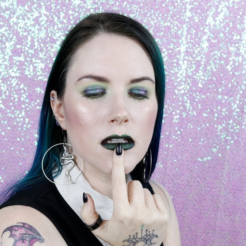 Courtney is wearing Black Moon Centipede highlighter, Slime & Myth lipsticks