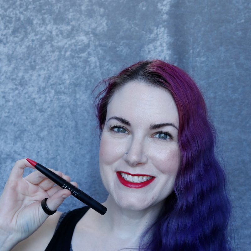 Phyrra holding Haus Labs Mastered Lip Crayon