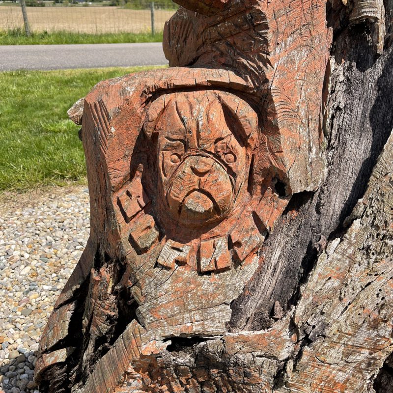a carving of a pug dog