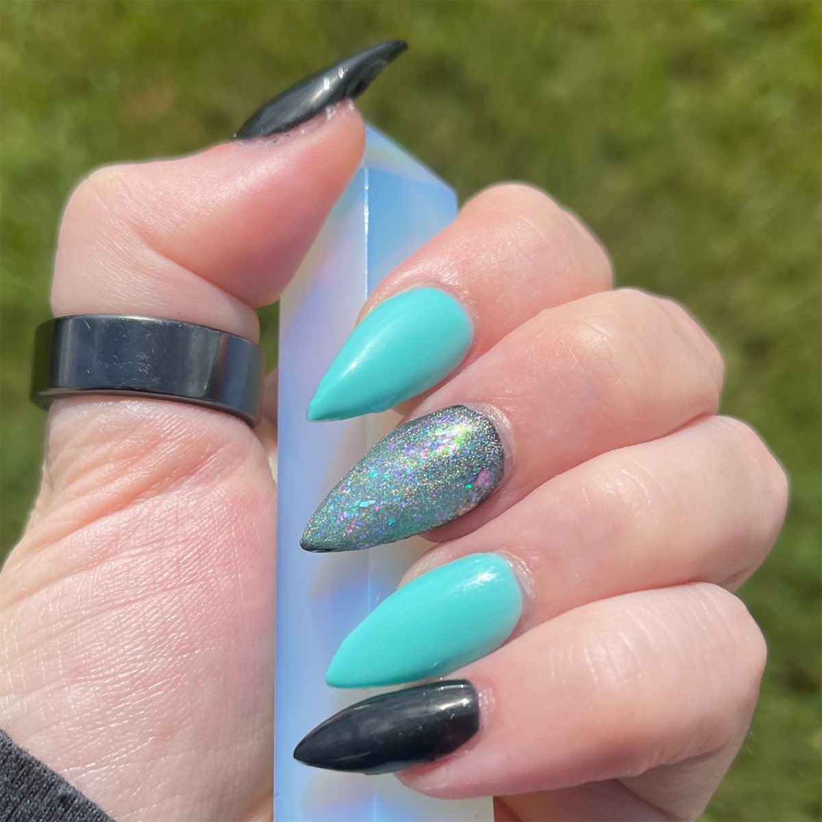 teal stiletto nails