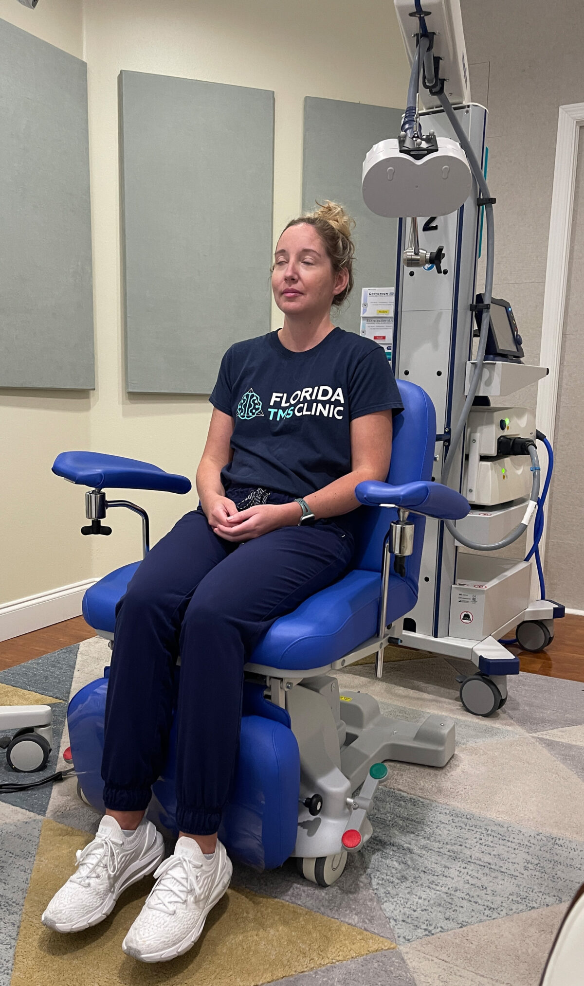 a woman waiting to receive TMS Therapy treatment in the chair