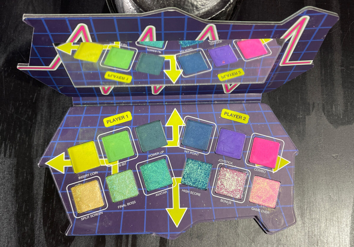 An eyeshadow palette with a Player 1 side and Player 2 side
