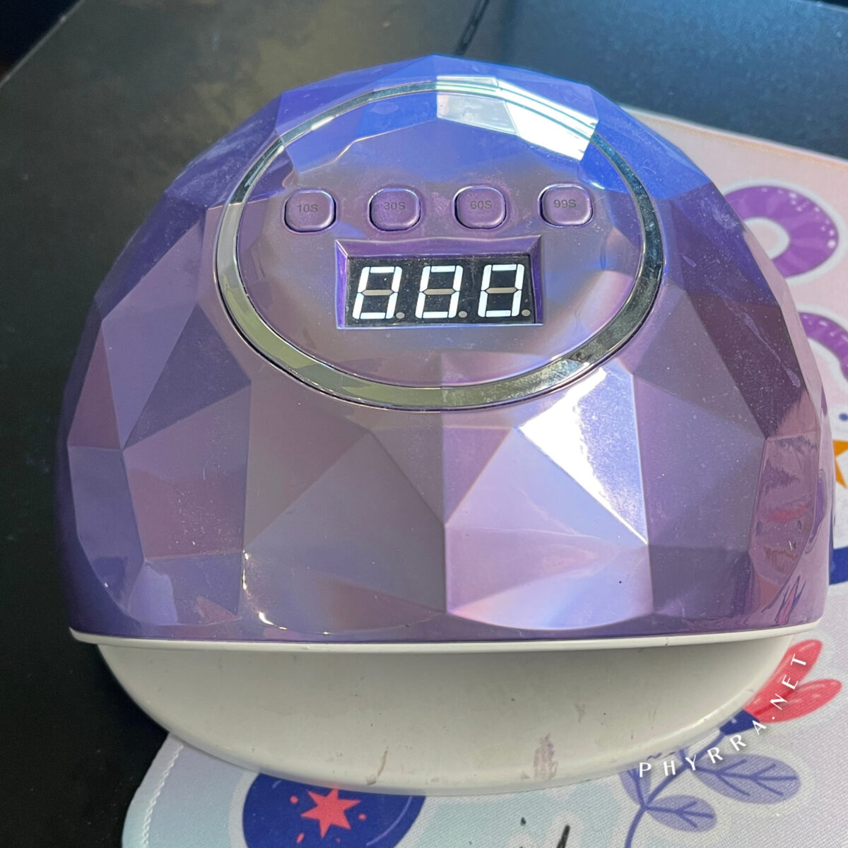 a purple LED UV Lamp for curing gel nails