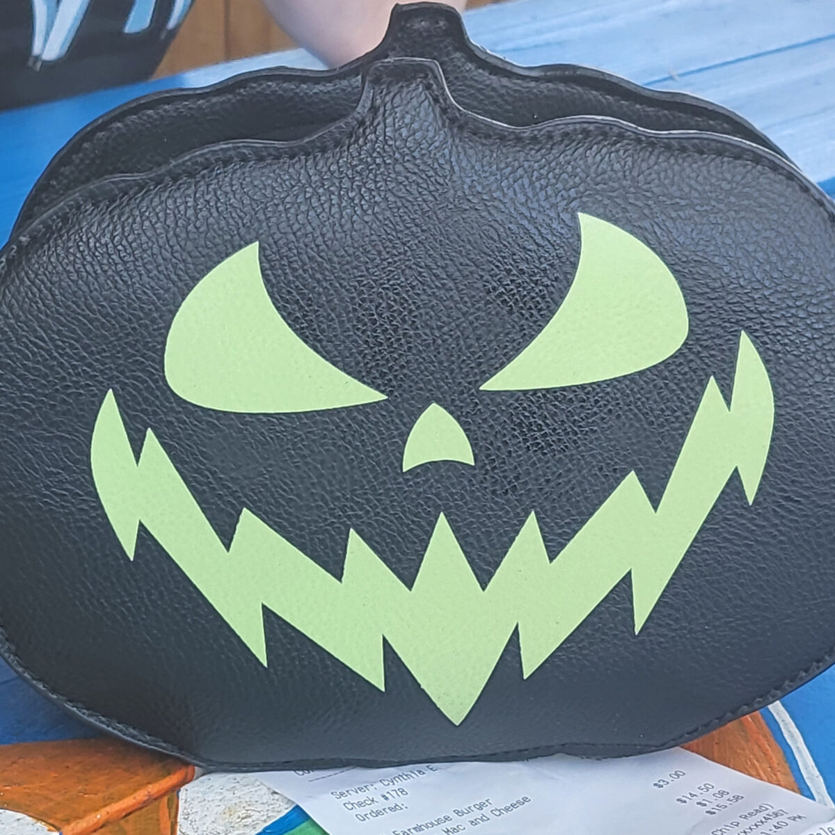a glow in the dark pumpkin purse