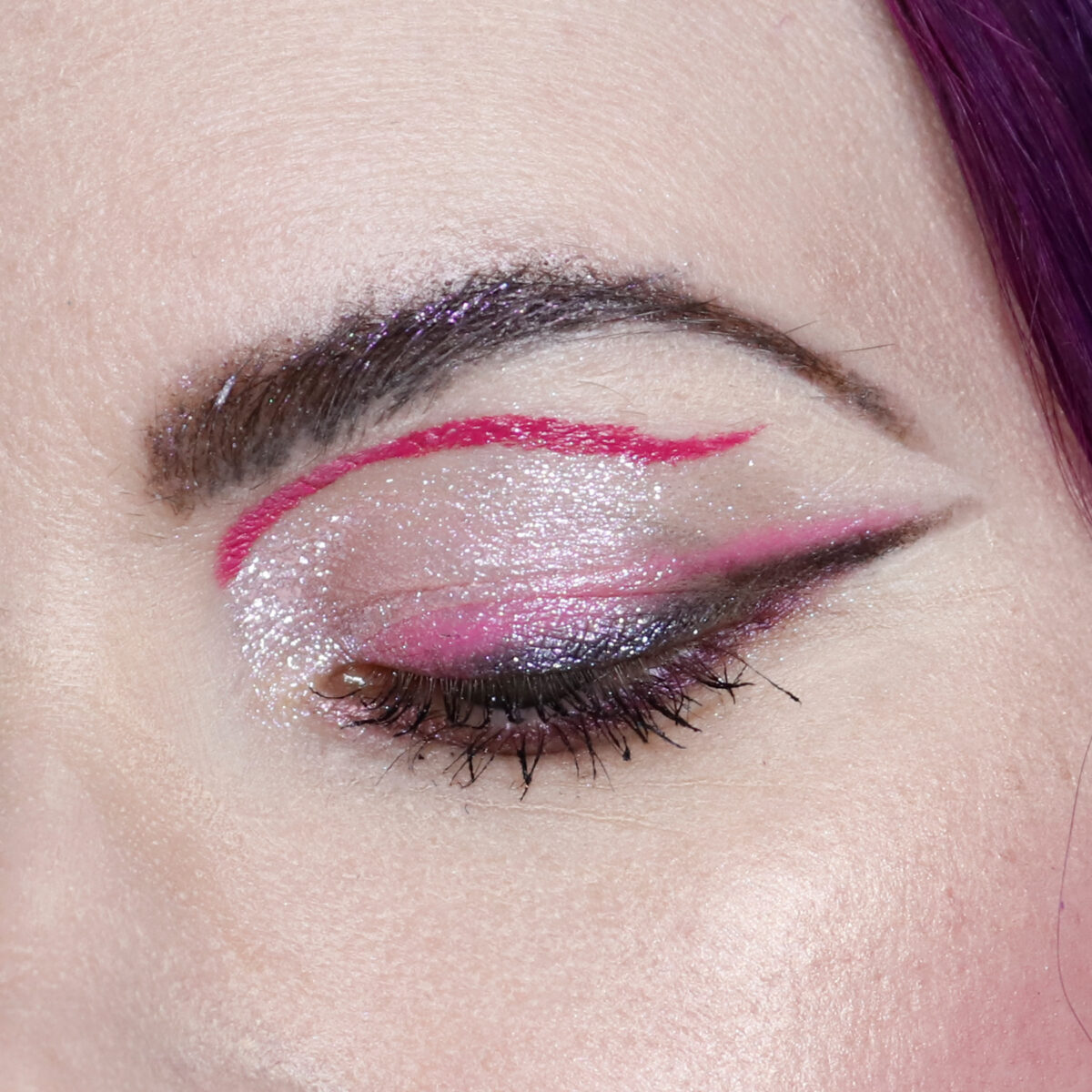 Graphic eyeliner with iridescent eyeshadow