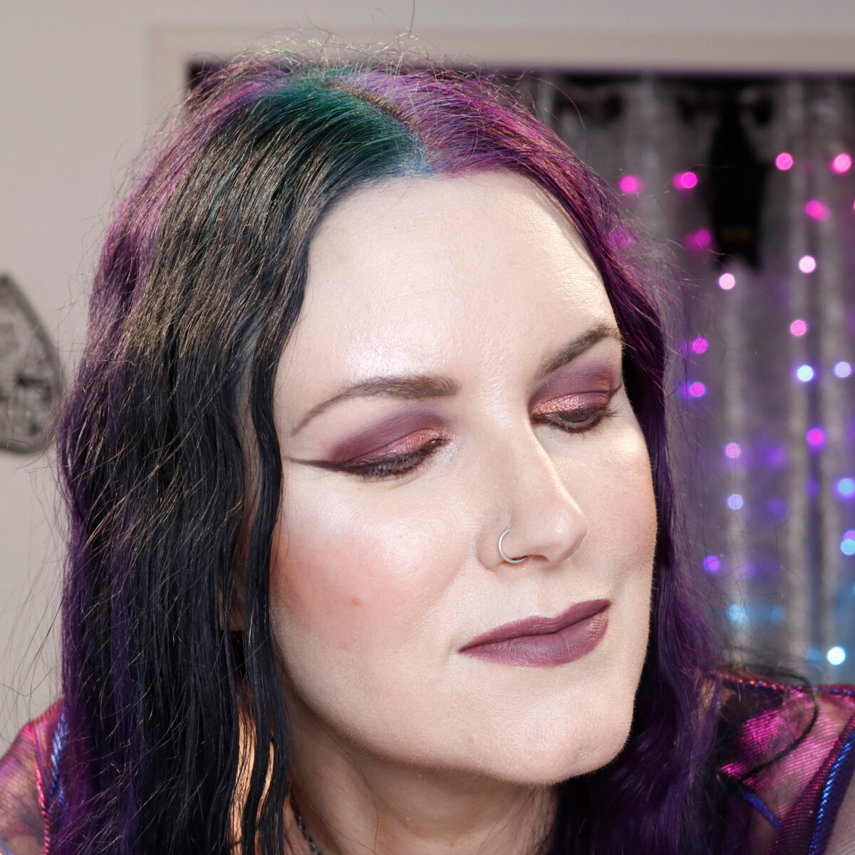A monochromatic purple taupe makeup look