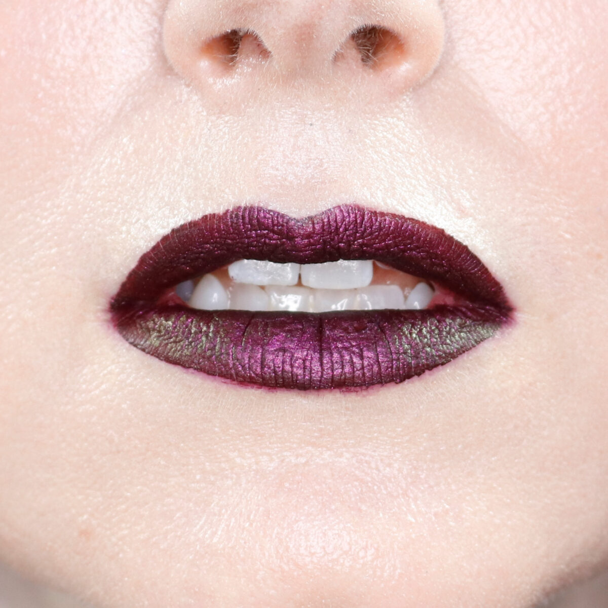 Melt Velvet Room Liquid Lipstick topped with a multichrome lipstick