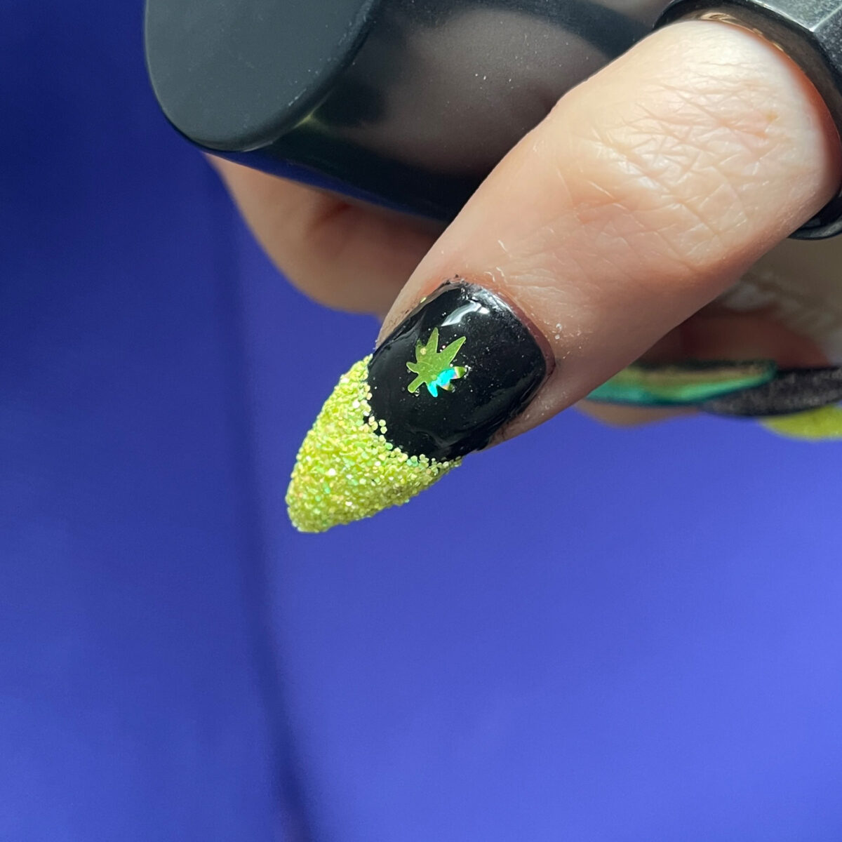 420 black nail with glitter french tip and holographic cannabis leaf
