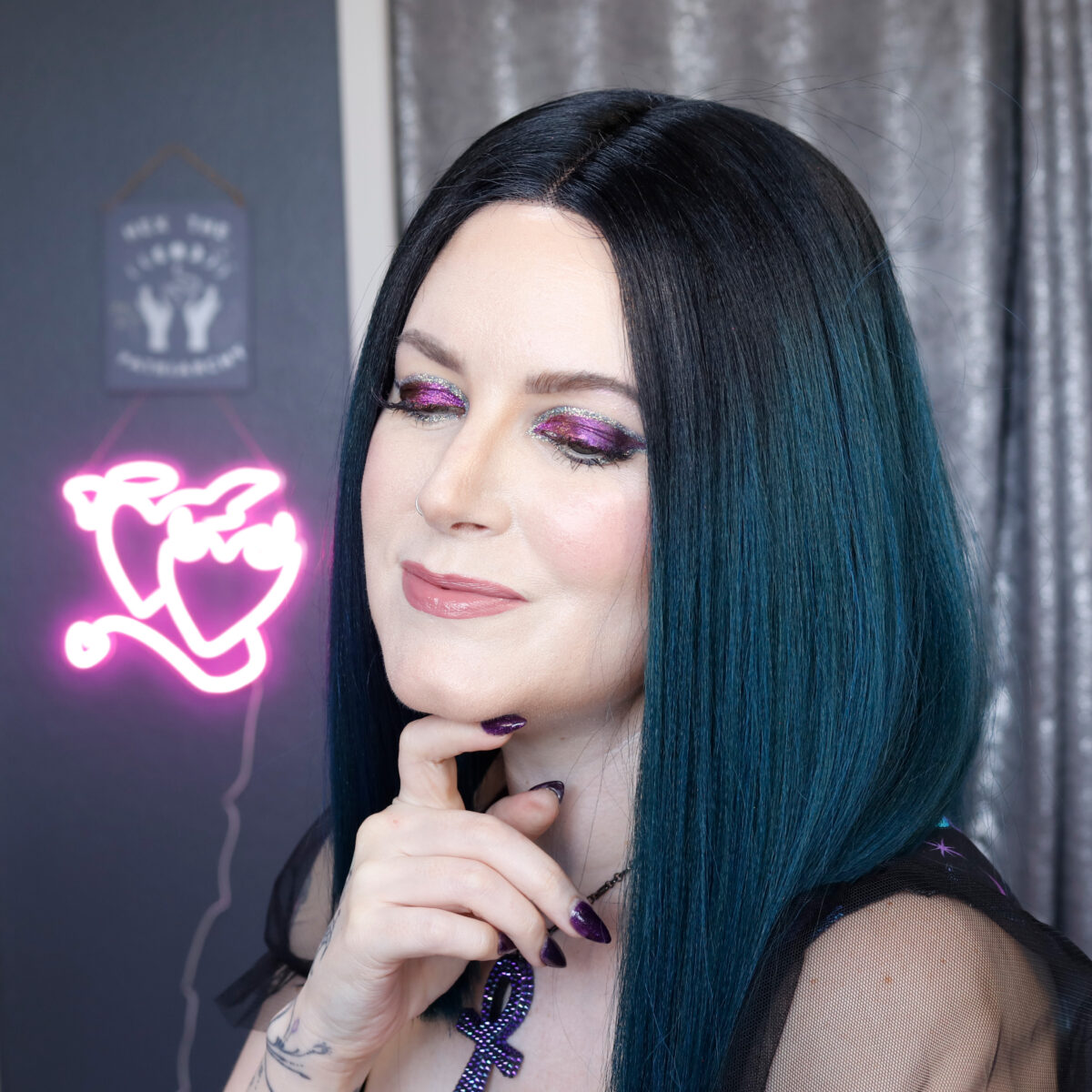 Cordelia is wearing a smoky teal wig with her Karla Cosmetics Night Terror Shadow Potion look