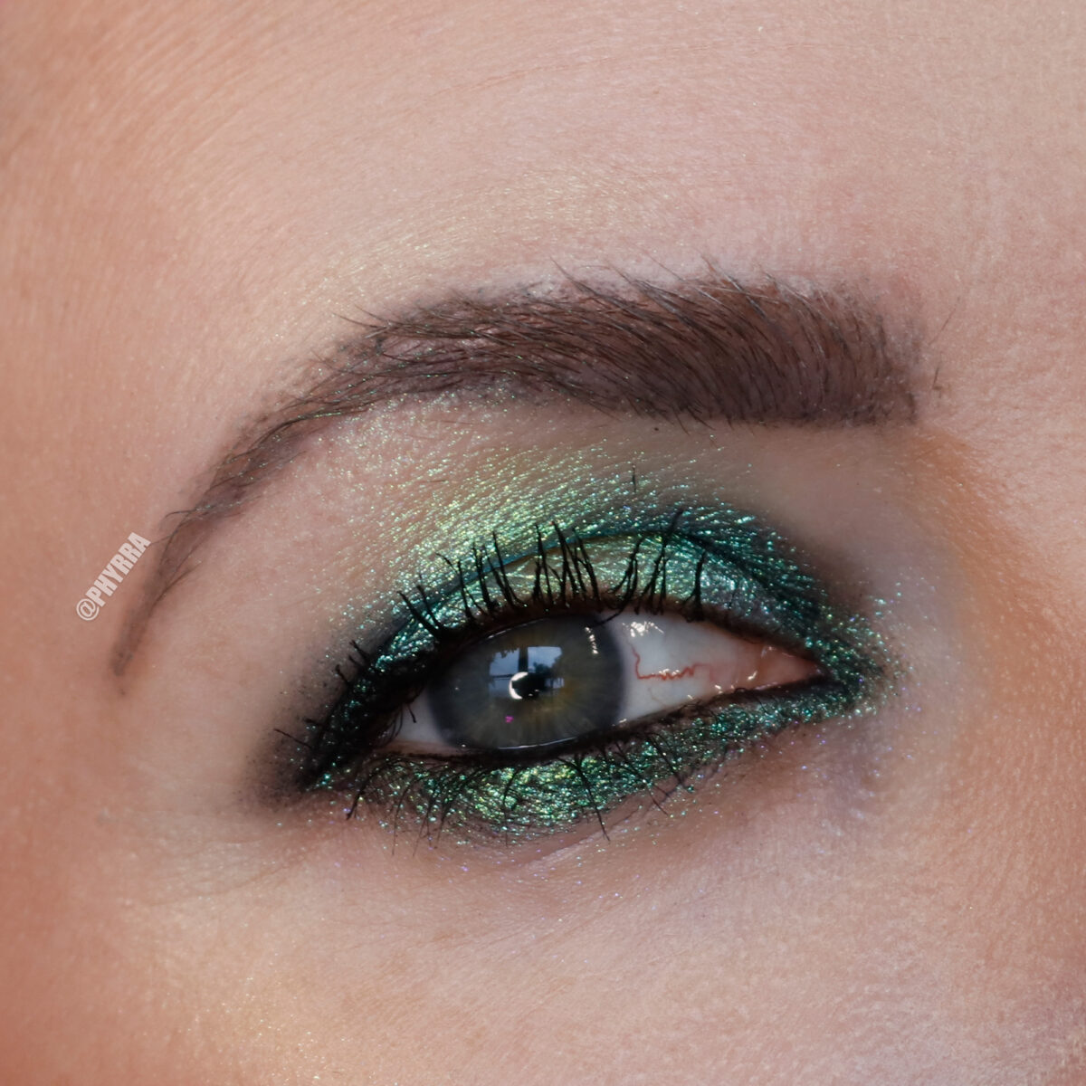 Cordelia is wearing KVD Green Nebula Dazzle Gel Eyeshadow