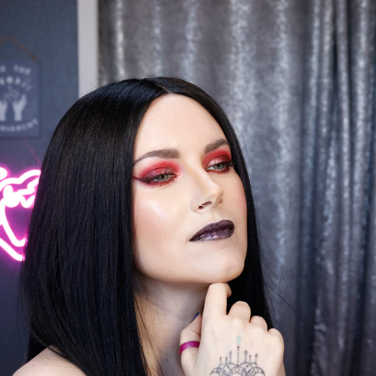 Gothic Beauty Cordelia is wearing red and black makeup inspiration
