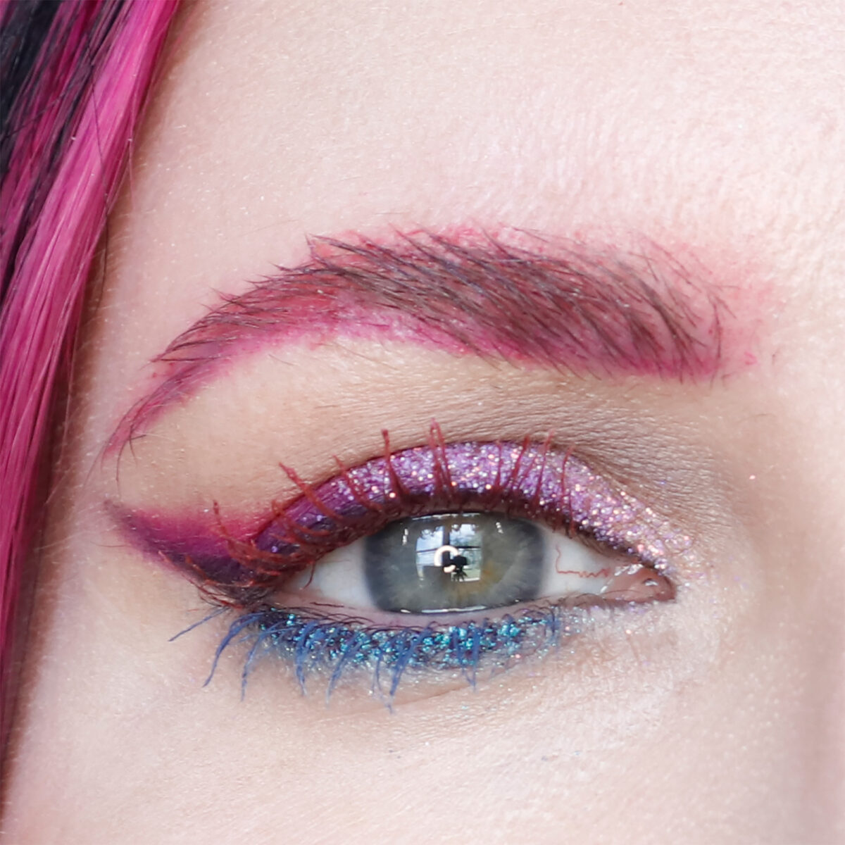 Purple, blue, and pink makeup by Cordelia Frost