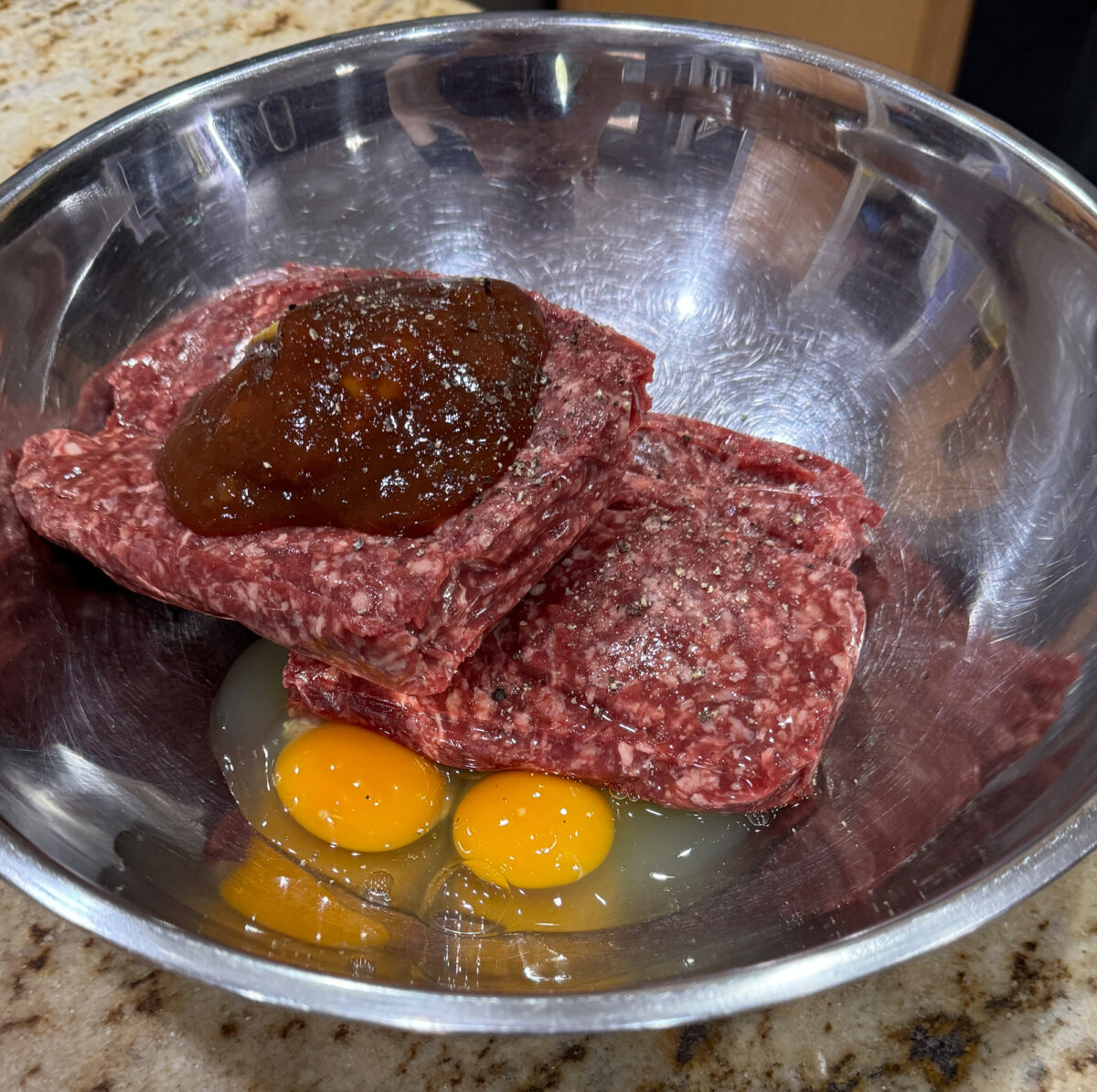 Frost Meatloaf mixture in the metal bowl