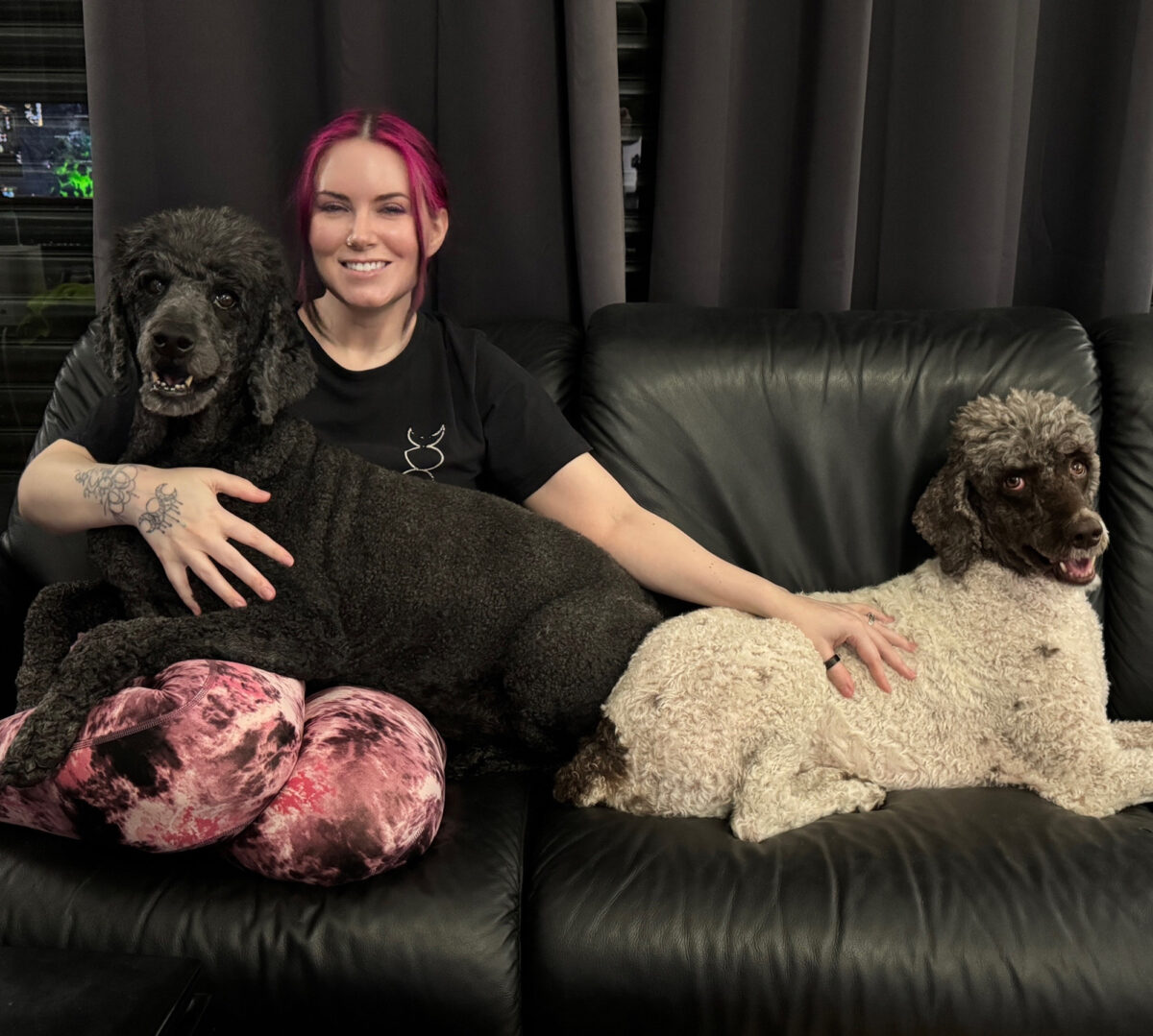 Cordelia with her two standard poodles Nyx and Amaya