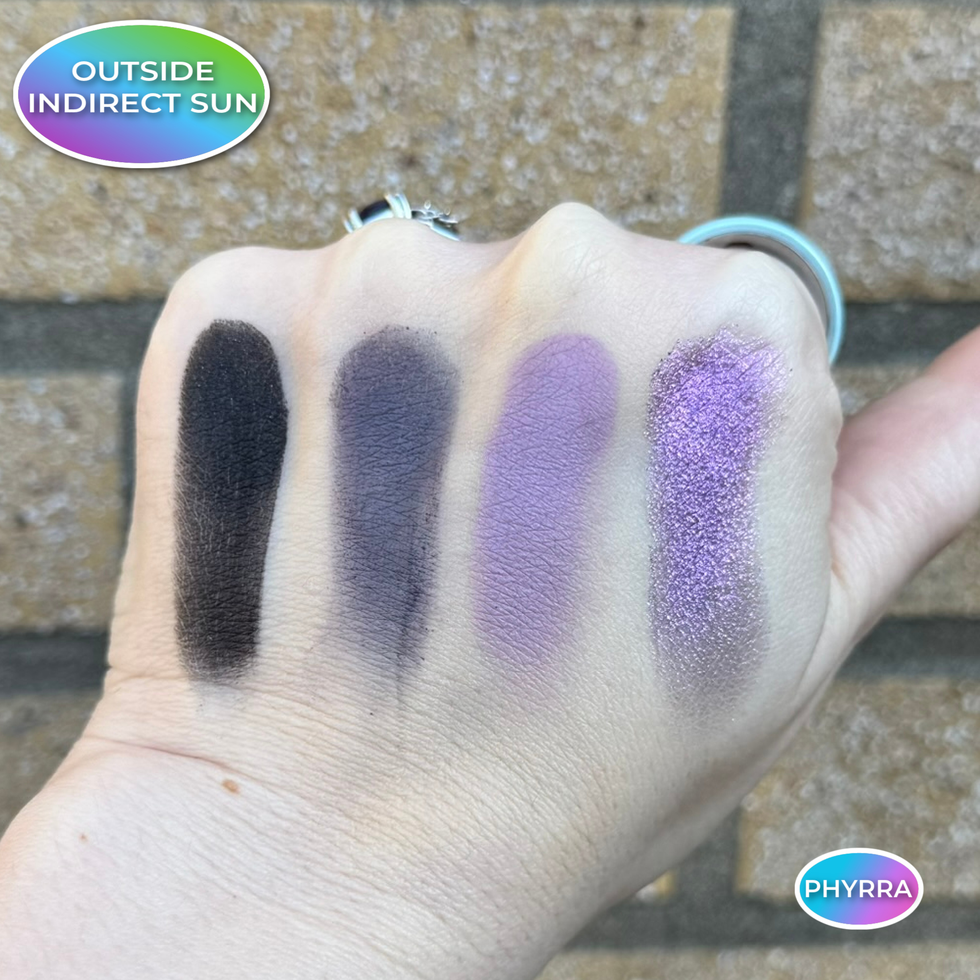 Kaleidos Twilight Rush Swatches on Pale Olive Skin in indirect sunlight